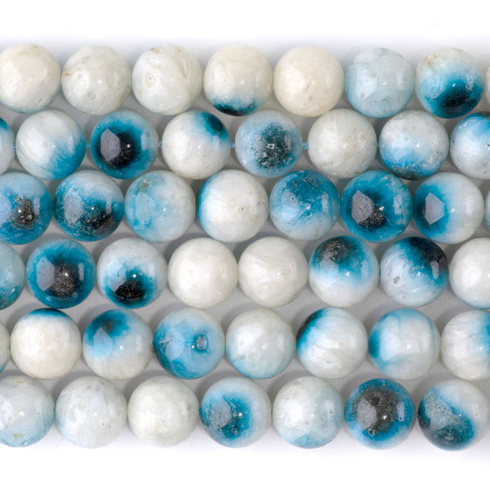 This is a Dakota Stones 10mm Blue Ice Glaciertite Gemstone strand with A grade round beads in 15-16 inch strand.