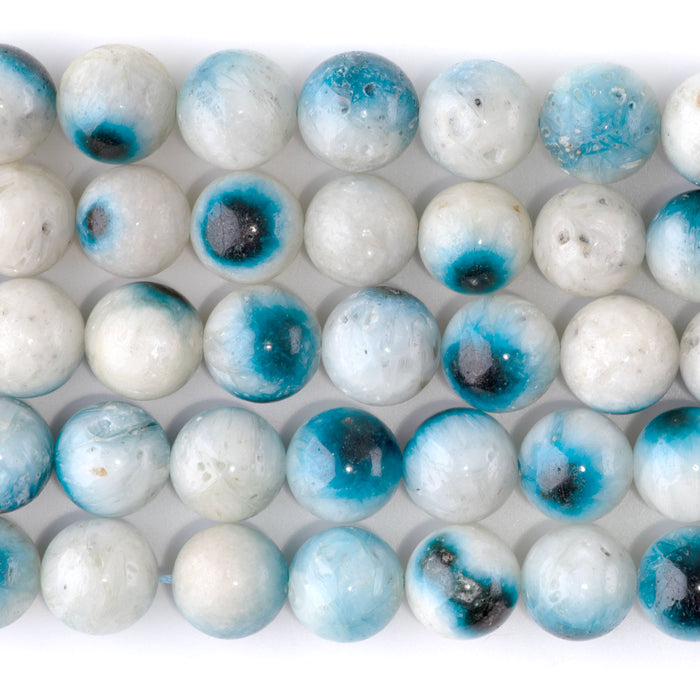 This is a Dakota Stones 12mm Blue Ice Glaciertite Gemstone strand with A grade round beads in 15-16 inch strand.