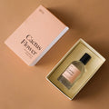 Dilo Cactus Flower perfume bottle in a box with packaging on a brown background