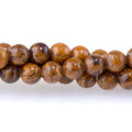 This is a Dakota Stones 4mm Elephant Skin Jasper Gemstone strand with round beads in 15-16 inch strand.