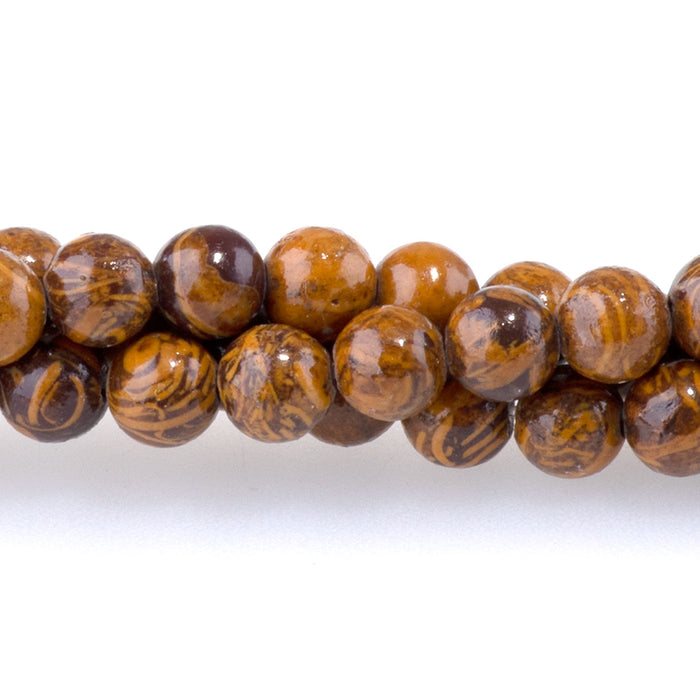 This is a Dakota Stones 4mm Elephant Skin Jasper Gemstone strand with round beads in 15-16 inch strand.
