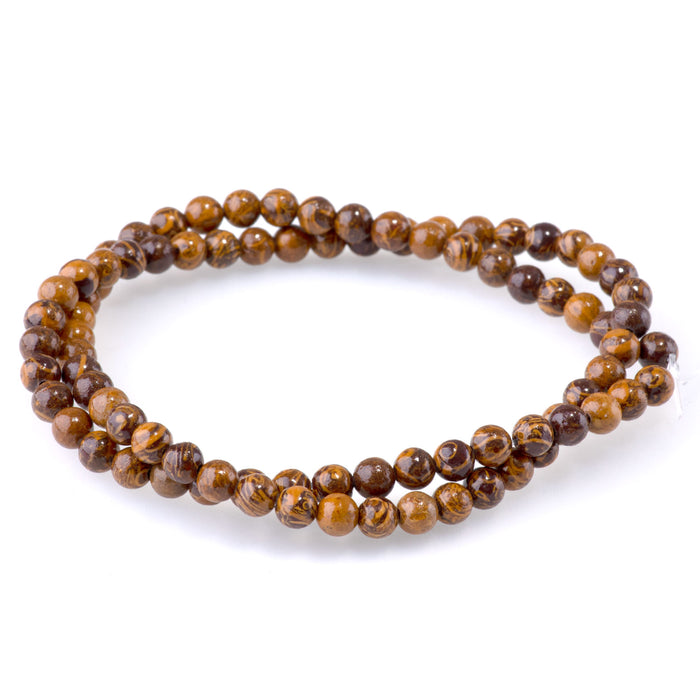 This is a Dakota Stones 4mm Elephant Skin Jasper Gemstone strand with round beads in 15-16 inch strand.