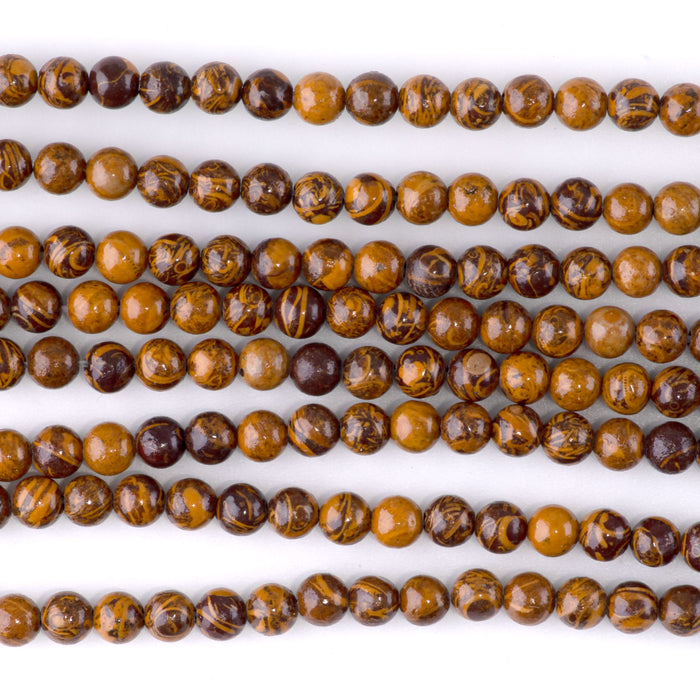 This is a Dakota Stones 4mm Elephant Skin Jasper Gemstone strand with round beads in 15-16 inch strand.