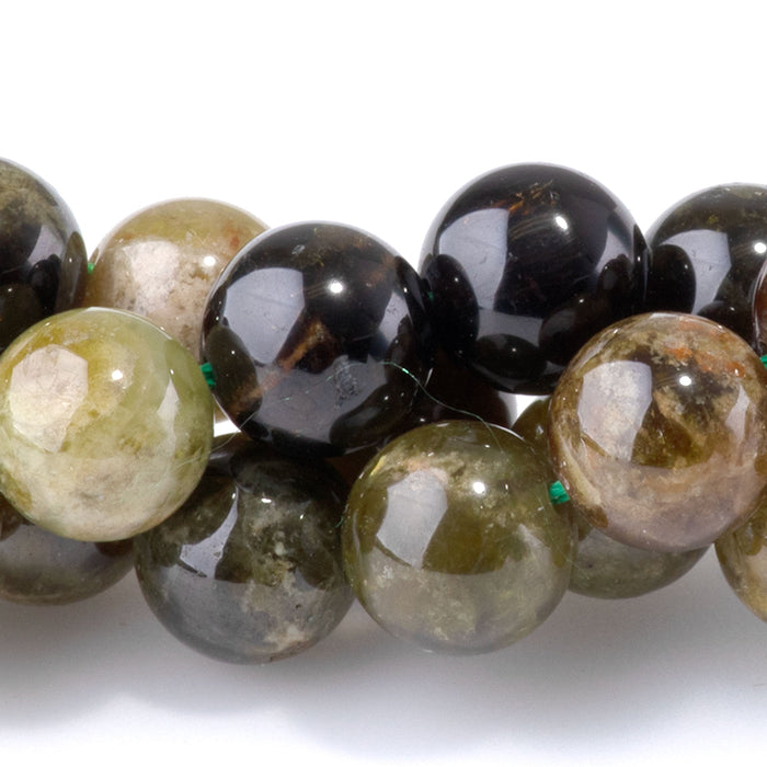 This is a Dakota Stones 8mm Green Garnet Banded Gemstone strand with round beads in 15-16 inch strand.