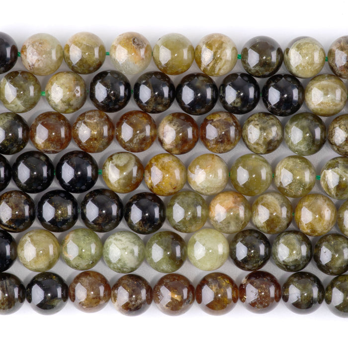 This is a Dakota Stones 8mm Green Garnet Banded Gemstone strand with round beads in 15-16 inch strand.