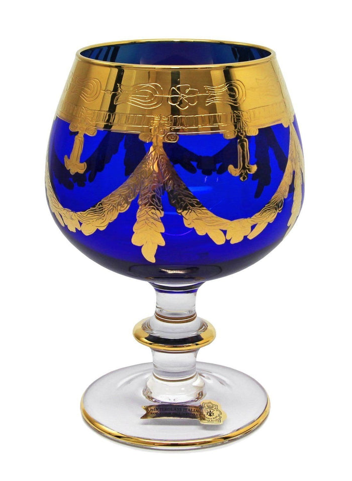 Interglass Italy blue crystal cognac snifter with 24K gold engraving on white background