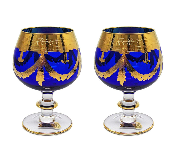 Side view of Interglass Italy blue crystal snifter showing cobalt hue and gold band detail
