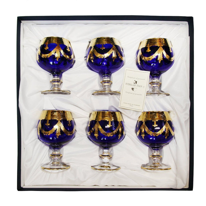 Full set of 6 Interglass Italy blue crystal cognac snifters with gold accents arranged together