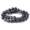 This is a Dakota Stones 10mm Iolite Gemstone strand with A grade round beads in 15-16 inch strand.