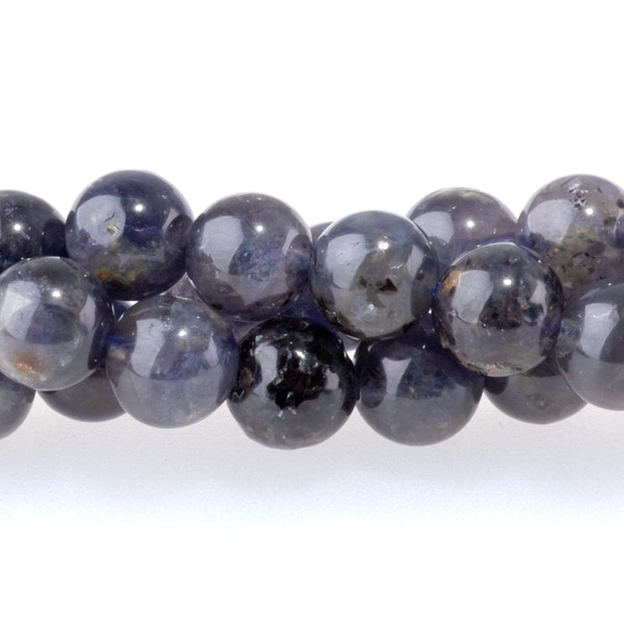 This is a Dakota Stones 6mm Iolite Gemstone strand with A grade round beads in 15-16 inch strand.