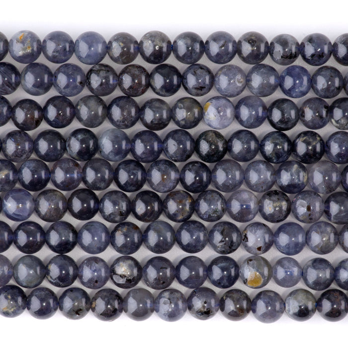 This is a Dakota Stones 6mm Iolite Gemstone strand with A grade round beads in 15-16 inch strand.