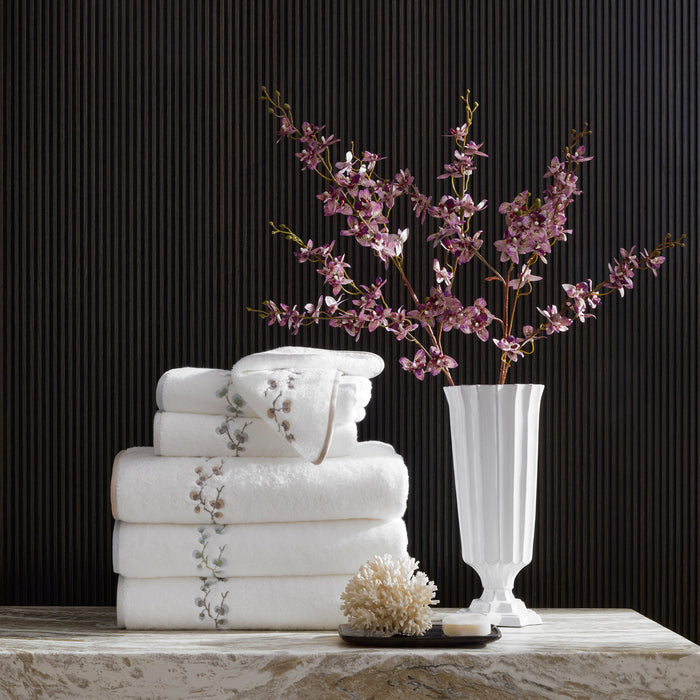 Matouk Jasmine Giza white long staple cotton luxury bath towels with elegant jasmine stem embroidery finished with a complementing tape edge