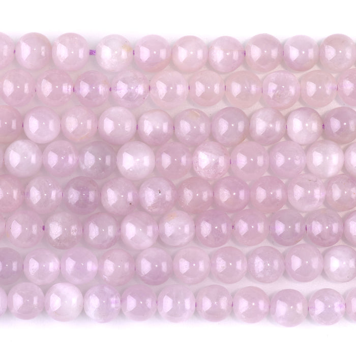 This is a Dakota Stones 6mm Kunzite Gemstone strand with AA grade round beads in 15-16 inch strand.