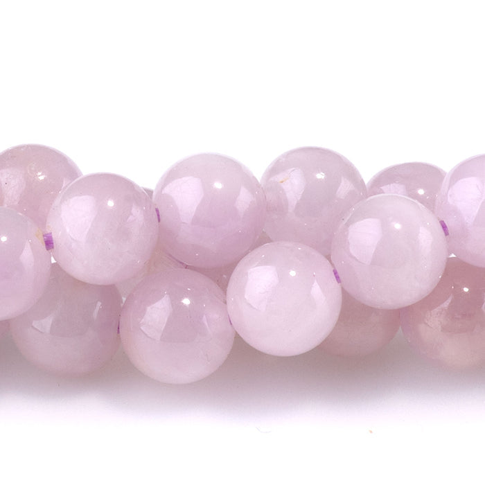 This is a Dakota Stones 6mm Kunzite Gemstone strand with AA grade round beads in 15-16 inch strand.