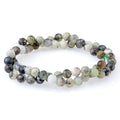 This is a Dakota Stones 6mm Madagascar Dendiritc Green Opal Gemstone strand with A grade round beads in 15-16 inch strand.