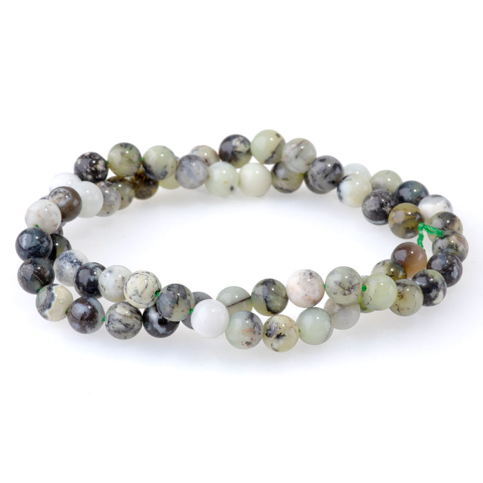 This is a Dakota Stones 6mm Madagascar Dendiritc Green Opal Gemstone strand with A grade round beads in 15-16 inch strand.