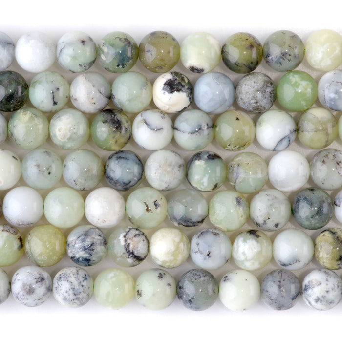 This is a Dakota Stones 8mm Madagascar Dendiritc Green Opal Gemstone strand with A grade round beads in 15-16 inch strand.