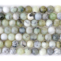This is a Dakota Stones 8mm Madagascar Dendiritc Green Opal Gemstone strand with A grade round beads in 15-16 inch strand.