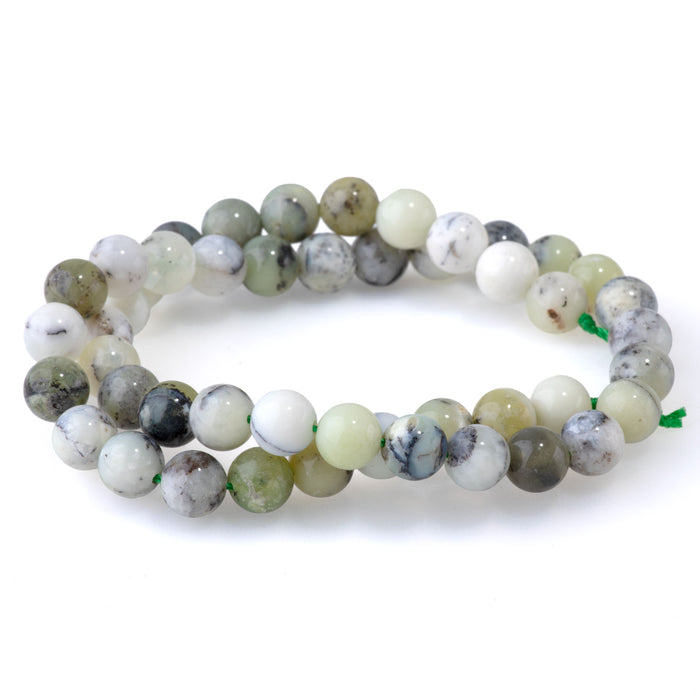 This is a Dakota Stones 8mm Madagascar Dendiritc Green Opal Gemstone strand with A grade round beads in 15-16 inch strand.
