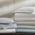 Matouk Matteo Cotton Seersucker Bedding in blue, green pink, white, beige, and brown hues