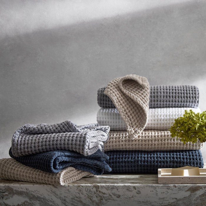 Matouk Cotton Waffle Bath Towels in Dove Grey, White, Dune, and Ink Dark Blue