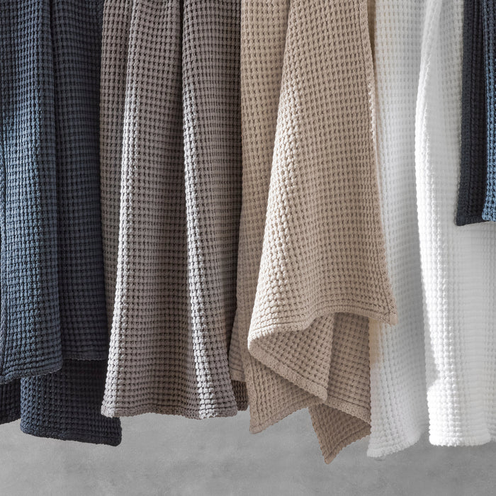 Matouk Cotton Waffle Bath Towels in Dove Grey, White, Dune, and Ink Dark Blue