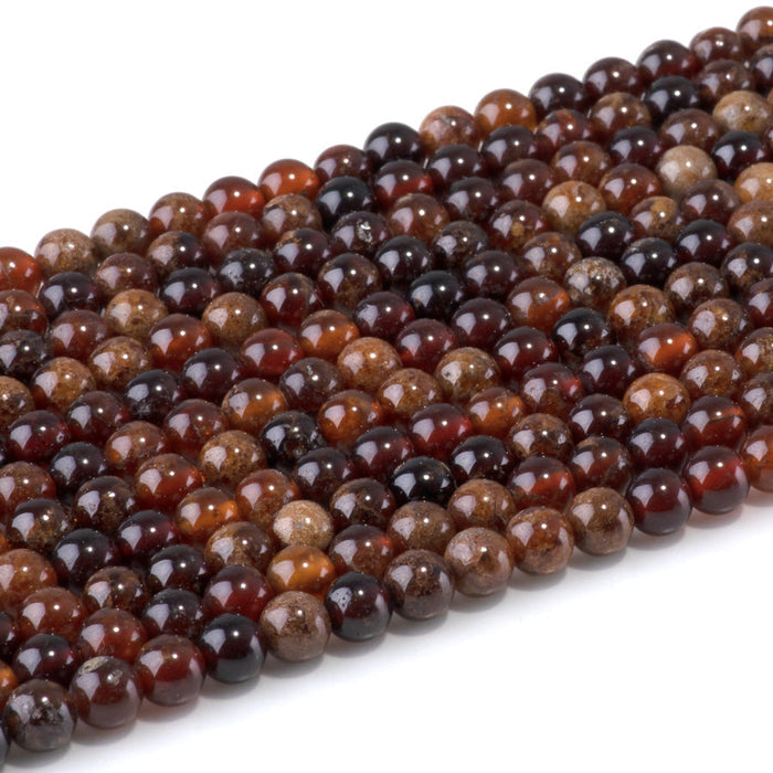This is a Dakota Stones 6mm Orange Garnet Gemstone strand with round beads in 15-16 inch strand.