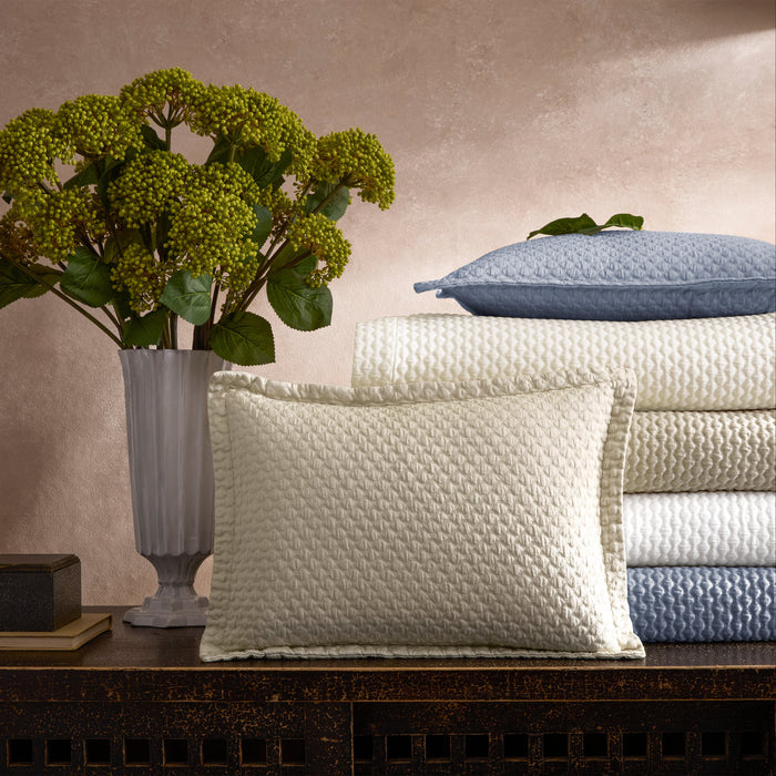 Matouk Perla pre-washed cotton coverlets and shams in almond, hazy blue, white, and ivory
